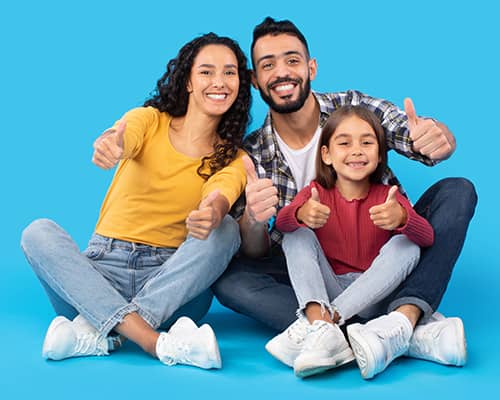 Happy family gesturing thumbs up after getting homebuyer assistance in Florida